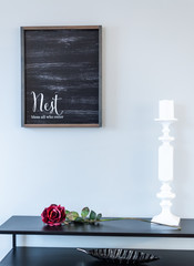 entry way table with chalk board and candlestick