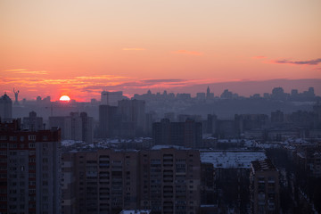 Sunset in Kiev, evening view of the panorama of the city, the church and the statue of the Motherland.  Evening color urban landscape