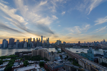 sunet brooklyn bridge views with lower manhattan and empire state building including 59th street bridge