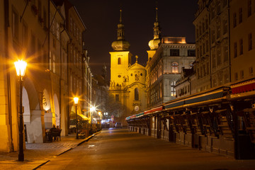 Fototapeta na wymiar Prague - The market and the Kostel svatého Havla church at night.
