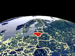 Lithuania from space on planet Earth at night with bright city lights. Detailed plastic planet surface with real mountains.