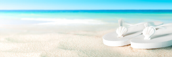 White Shells And Sandals On Sandy Beach With Tropical Water And Blue Sky - Beach Holiday Concept