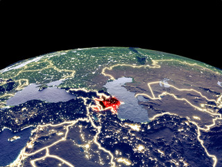 Azerbaijan from space on planet Earth at night with bright city lights. Detailed plastic planet surface with real mountains.