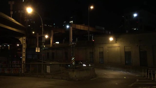 NEW YORK CITY - APRIL 14, 2018: A establishing shot of traffic and cars at night NX near Ed Koch Queensboro bridge on Upper East Side Manhattan