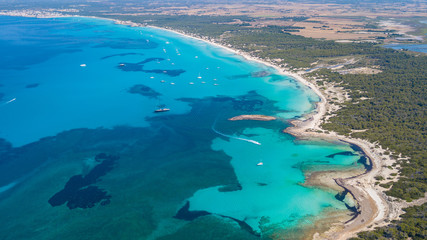 Obraz na płótnie Canvas Amazing drone aerial landscape of the charming beach Es Trencs. It has earned the reputation of Caribbean beach of Mallorca. Spain