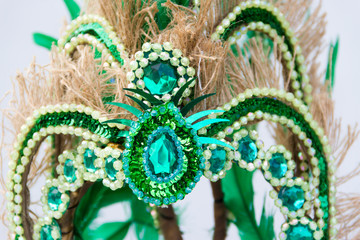 detail of bright stones and carnival feathers