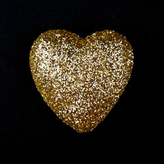 Gold heart over black