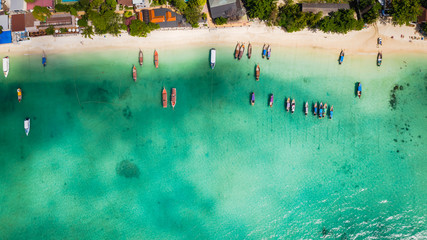 hi season boat and tourists on phiphi island Krabi Thailand aerial view from drone