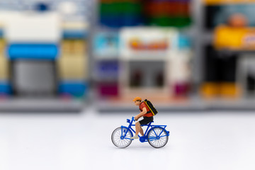 Miniature people : Travelers riding bicycle. Image use for background traveling and healthy, exercise concepts.