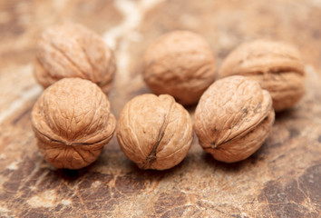 Walnuts on a marble table on the table