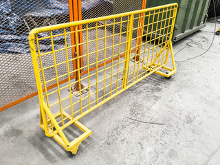 Yellow safety fence in factory area, Safety partition for protect dangerous working area