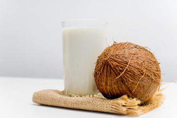 a glass of milk with bread and grains