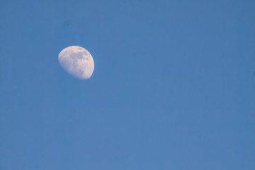 moon in evening time on beautiful natural blue sky background
