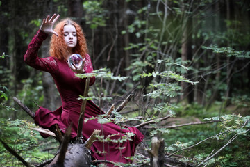 Witch holds a ritual sphere