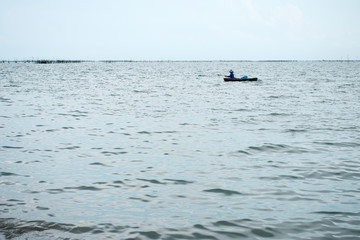 sailor boating in the sea in rainy day, caravel in the middle of ocean