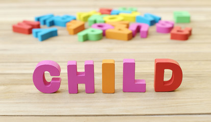 Obraz premium Colorful Word ' CHILD ' on Wooden Table, Learning English Language 