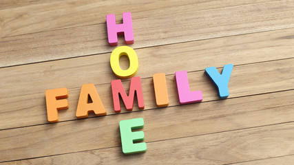 Colorful Word ' HOME and ' FAMILY ' on Wooden Table