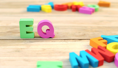 Colorful Wooden Word ' EQ '  or Emotional Quotient in Child