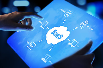 SaaS - Software as a service, on demand. Internet and technology concept on virtual screen.