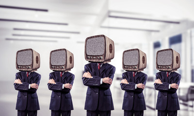 Businessmen with old TV instead of head.