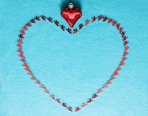 Lines of heart on a blue background are made of red figures of the flying cherubs. Love symbols in...