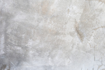 Grey cement wall texture background, blank grey background, natural crack pattern on concrete wall