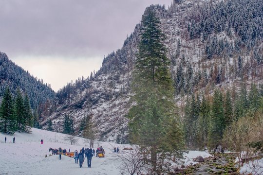 Winter in mountains, tourists rest at a sleigh stop, winter hiking in the Tatra Mountains