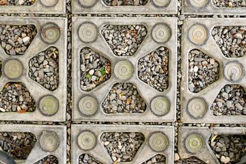 close up texture background stone. ornamental stones lined up on the ground in the park