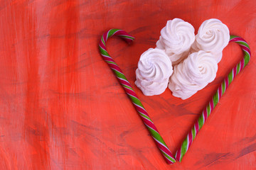 Light and airy marshmallows on a coral-colored background.Fashionable color coral - 2019.painted in the fashionable color of 2019