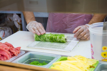 Sushi making at a fast food restaurant