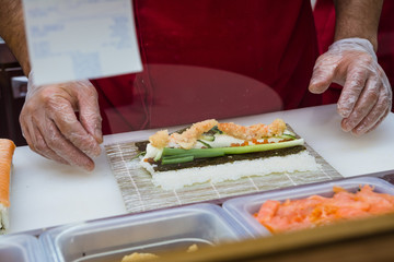 Sushi making at a fast food restaurant