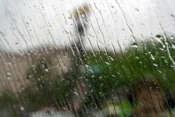 rain on car glass window in washington dc