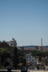 View along the busy main road in Rome, Italy, with the National Monument and other famous landmarks
