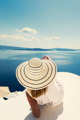 Fototapeta na wymiar Luxury travel vacation woman looking at view on Santorini island