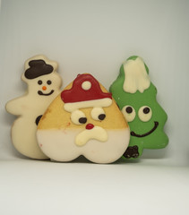  Christmas cookies in the shape of Santa Claus, Christmas tree and snowman. Tasty Christmas cookies. Gift ideas for Christmas.