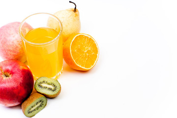 different fruit and juice or smoothie in a glass