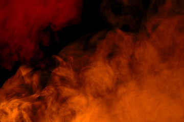 mystical abstraction orange and red cigarette vapor on a dark background