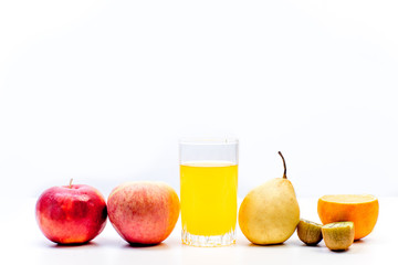 different fruit and juice or smoothie in a glass