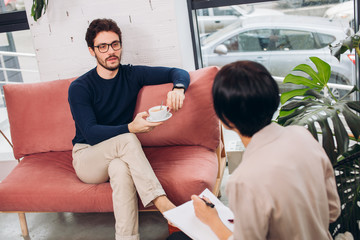 businessmen and his secretary are chatting in the room with modern interior.psycological support