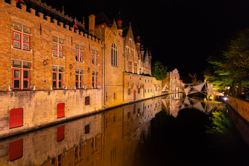 Fototapeta na wymiar Bruges, Belgium, at night with its historic old town and canals illuminated.