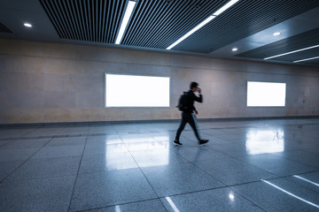 Fototapeta na wymiar Blank Billboard Banner Light box in Subway station with blurred people Travel
