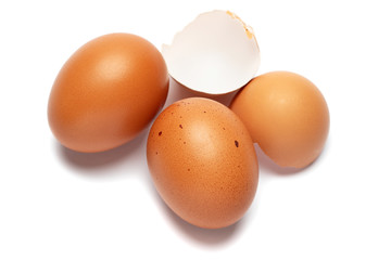 brown chicken eggs closeup isolated on white background