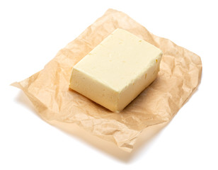 Piece of organic butter on a white background