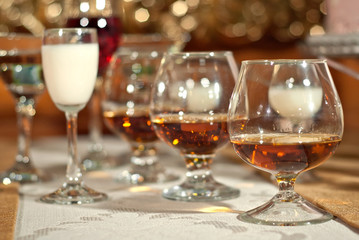 Glass glasses with colored drinks on the table. alcoholic drinks at the buffet