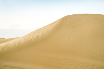 Large desert dune with a falling sand