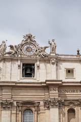 Fototapeta na wymiar Ornate clock and, bell with statues, on St Peter's Basilica, Vatican City, Rome, Italy