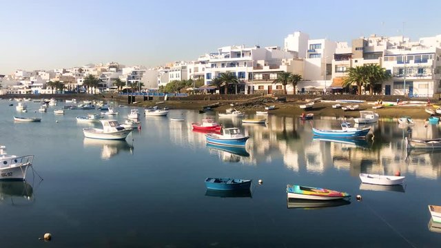 The lagoon of Charco de San Gines in Arrecife with a flotilla of small boats on a sunny afternoon, Lanzarote, Canary Islands, Spain, 4k footage video.