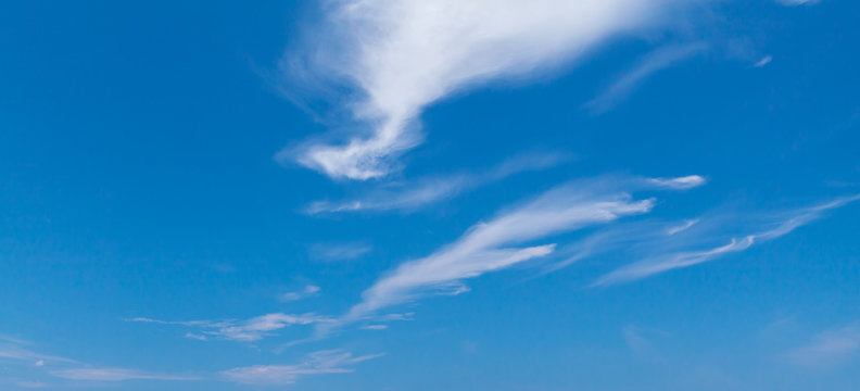 Blue sky with windy cirrus clouds at daytime