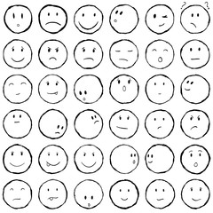 Smiley faces collection in hand drawn technique and grunge style set isolated on white.