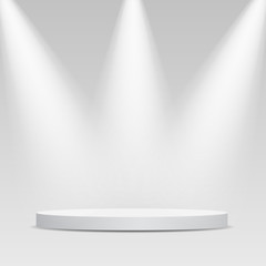 Round podium, pedestal or platform illuminated by spotlights on grey background.